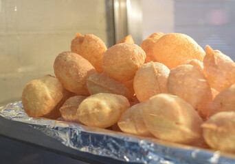 Pani puris displayed at local business in street market, traditional Indian food