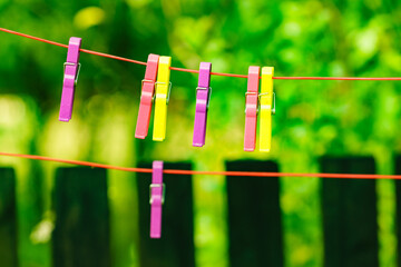 Clothes pegs on line outdoor. Housework