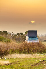 Camper van with roof top tent camp on nature