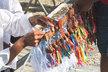 Candomble fans and souvenir sellers are seen during a party for Sao Roque in the city of Salvador,...