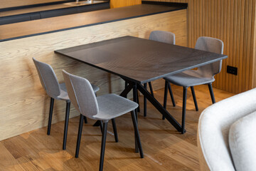 Modern dining table with chairs in luxury apartment