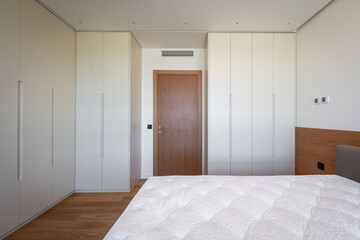 Modern bedroom interior with wooden walls and warm ambient light