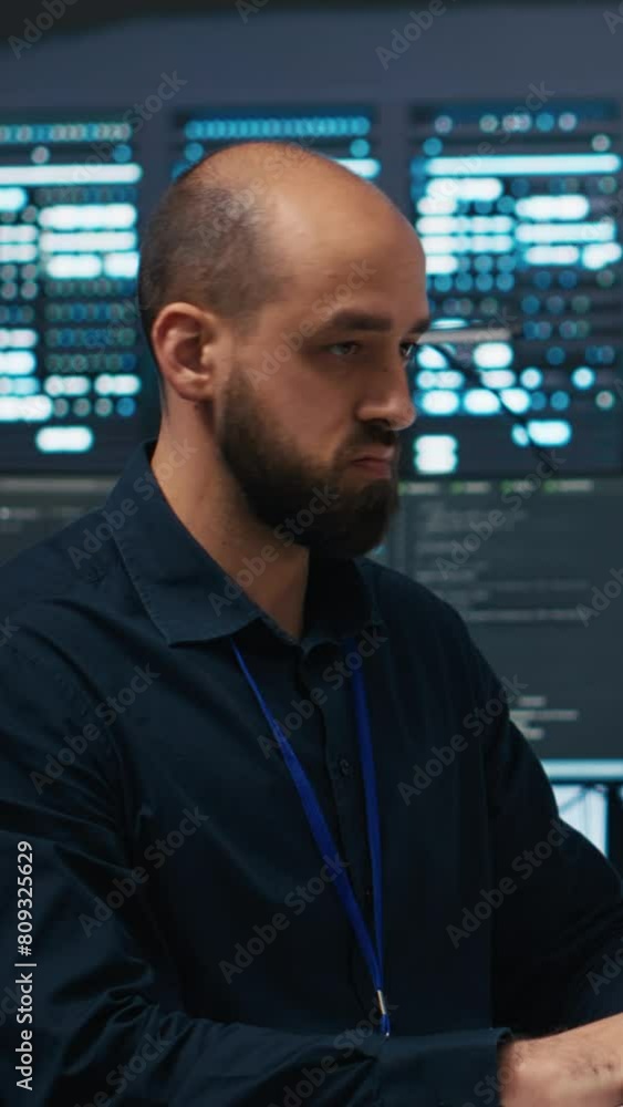 Aufkleber vertical video technician using pc in high tech server hub facility to safeguard data from intruding