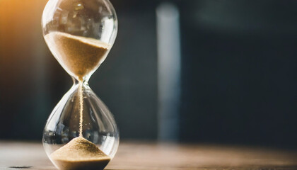 sand running through hourglass bulbs, symbolizing passage of time, life transitions, retirement, and freedom