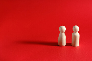Family people figures on red background. Concept of family, values, unity, togetherness and relationship.