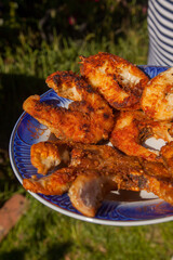 Crispy spicy fried fish steaks on a plate..