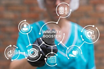 Doctor working on virtual touch screen presses inscription: IMMUNITY BOOSTER. Immunity booster...