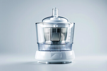 A compact juicer with a transparent lid and a non-slip base isolated on a solid white background.
