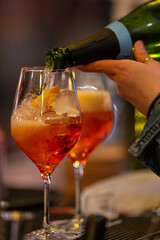 Aperol Spitz prepared on a bar counter.