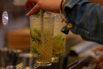 Mojitos prepared on a bar counter.