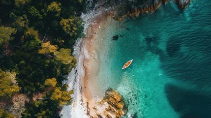 A serene aerial view of a wooden kayak floating in the clear waters near a sandy beach, with lush green trees creating a beautiful natural landscape AIG50