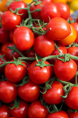 fresh ripe red cherry tomatoes background.