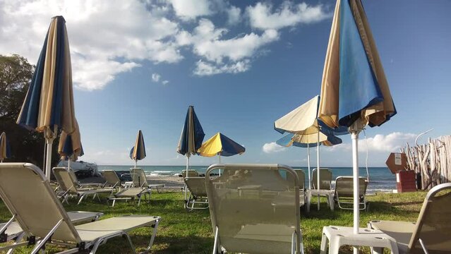sunbeds and parasols on the beach of Argassi in Zakynthos
