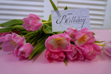 postcard , Internet banner  with a birthday greeting, with the inscription - happy birthday,  a bouquet of flowers with a note of congratulations