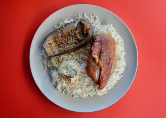 Peking duck on a bed of basmati rice with seasoned artichoke an char grilled eggplant.