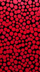 A red and black background filled with various sized circles in a repetitive pattern