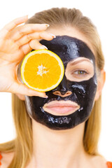 Girl black carbo mask on face 