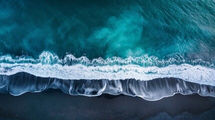 Fototapeta premium Dramatic Aerial View of a Black Sand Beach and Waves