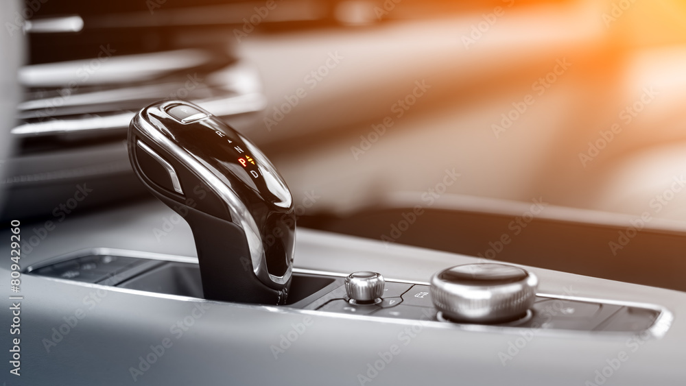 Poster close up of the manual gearbox transmission handle. accelerator handle and buttons in a new car. .