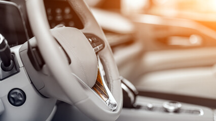 Close up of the modern car interior view with dashboard, multifunction  leather steering wheel,...