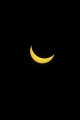 Partial solar eclipse with black background