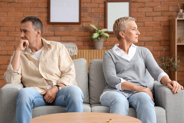 Offended mature couple after quarrel at home