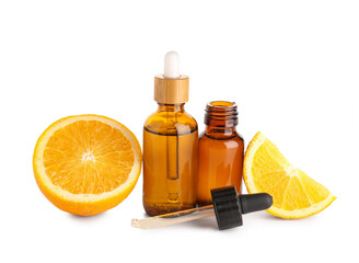 Bottles of vitamin C with orange on white background