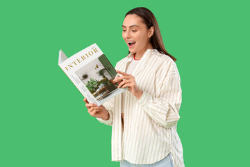 Young woman reading interior magazine on green background