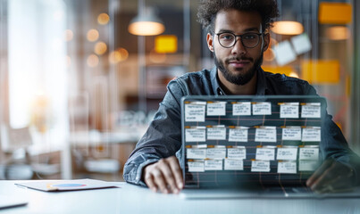 Business developer using Kanban board framework on laptop computer - agile software development, lean project management tool for fast changes