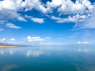 Sunny summer day on the lake. Mountains and sea. Kyrgyzstan, Lake Issyk-Kul