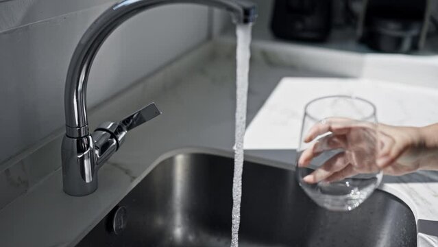 Young beautiful hispanic woman  at the kitchen