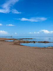 Sunny summer day on the lake. Mountains and sea. Kyrgyzstan, Lake Issyk-Kul