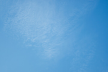 Bright sky with white clouds
