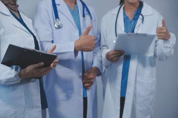 Quality healthcare is all about putting the patient at the centre. Shot of a group of medical practitioners having a discussion in a hospital.