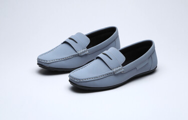 light blue leather loafers slip on shoes isolated on grey background