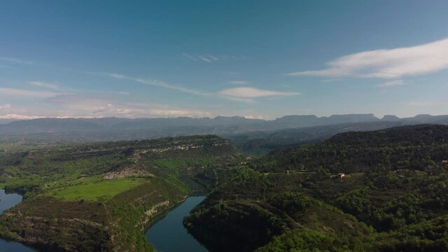 The lush salvassola vic landscape near barcelona, clear skies and serene waters, aerial view