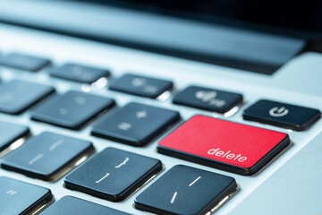 Computer user, he presses the delete button on the computer keyboard	