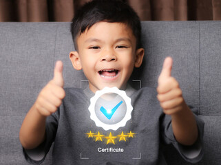 little boy giving you thumb up over. for the certificate concept, online survey exam and choose the...
