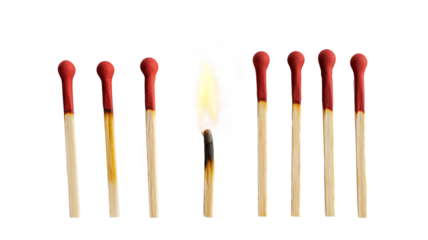 Lit match next to a row of unlit matches isolated on a transparent background