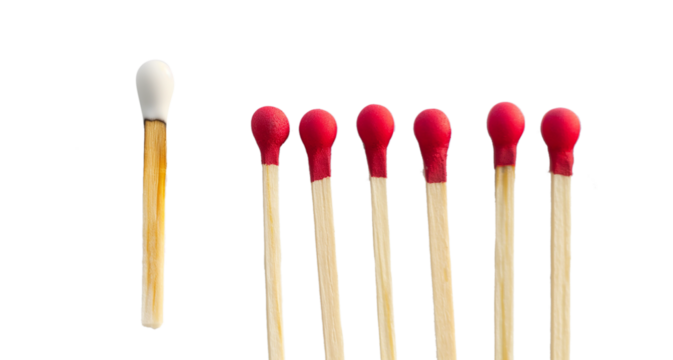 Lit match next to a row of unlit matches isolated on a transparent background