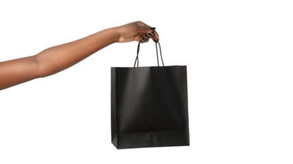 lose up a black female hand holding a black paper bag isolated on a transparent background