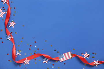 USA flags, stars and ribbon on blue background. American Independence Day celebration