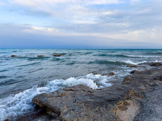 Sunny summer day on the lake. Mountains and sea. Kyrgyzstan, Lake Issyk-Kul