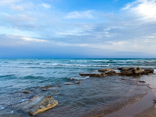 Sunny summer day on the lake. Mountains and sea. Kyrgyzstan, Lake Issyk-Kul