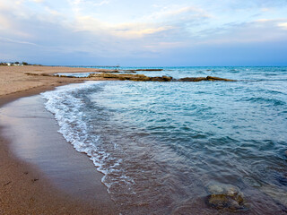Sunny summer day on the lake. Mountains and sea. Kyrgyzstan, Lake Issyk-Kul