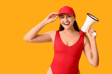 Female lifeguard with megaphone on yellow background