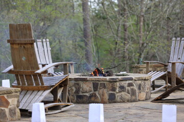 Fireside Haven: Stone Fire Pit with Wooden Seating