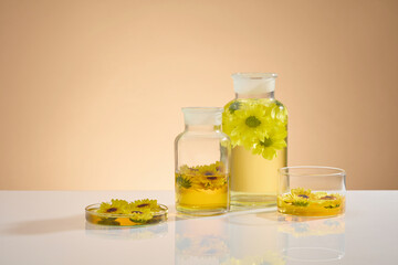Frontal shot photo to advertise organic product extracted from calendula flower. Calendula is a...