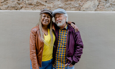 Joyful Senior Couple Sharing a Warm Embrace in Urban Setting