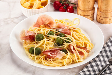 Pasta spaghetti with olives and jamon